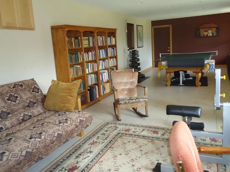 Downstairs walkout Game Room with Pool and Ping Pong Table, Card Table,
and Futon with Queen Innerspring Mattress