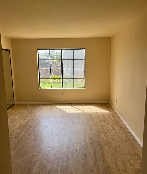 Second Bedroom, with window looking out to canyon.. New vertical blinds have been added to the window
