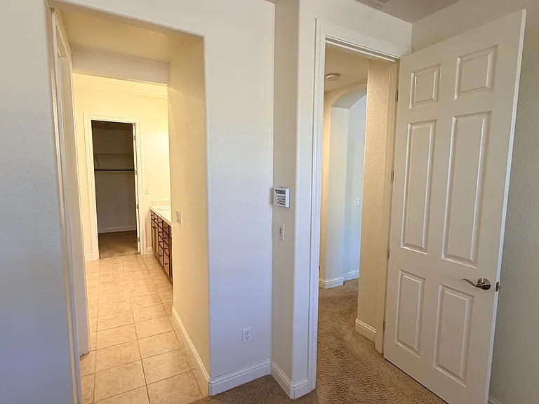 Main bedroom looking into en-suit bathroom and walk-in closet
