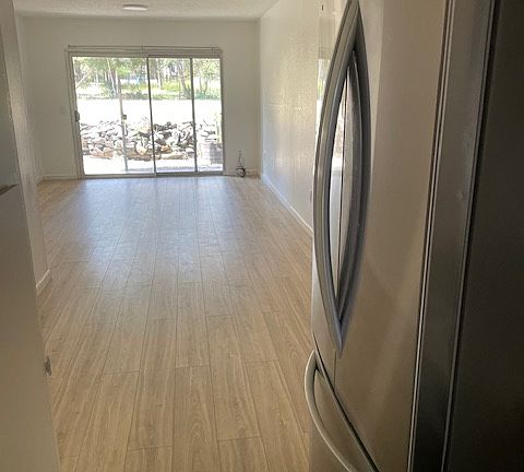 kitchen w new cabinets, counters and appliances