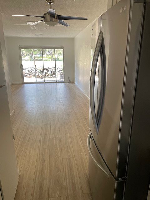 kitchen w new cabinets, counters and appliances