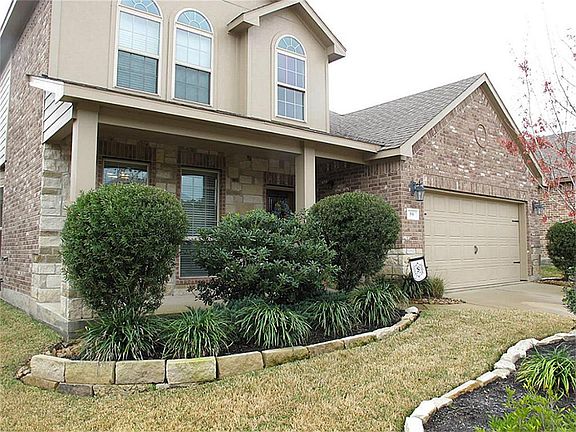 CURB APPEAL GALORE! A STUNNING brick/stone elevation along with a cozy front porch greet guests to this lovely home!