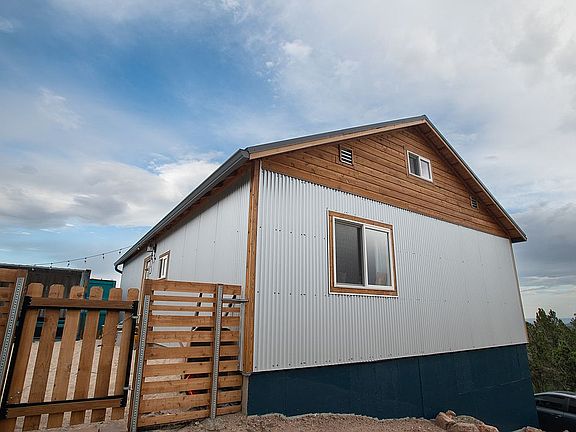 Fenced yard with sand