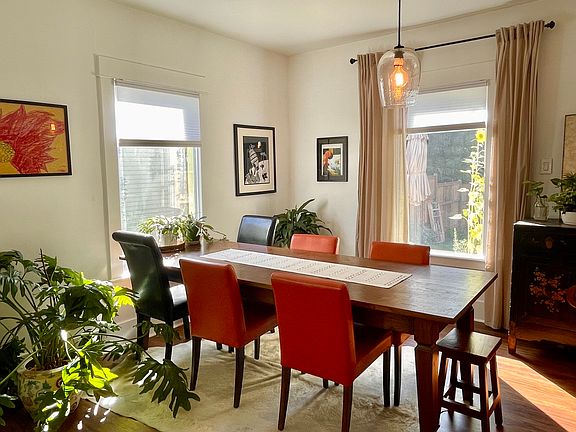 Spacious living room for family dinners, creative projects, or work sessions.
