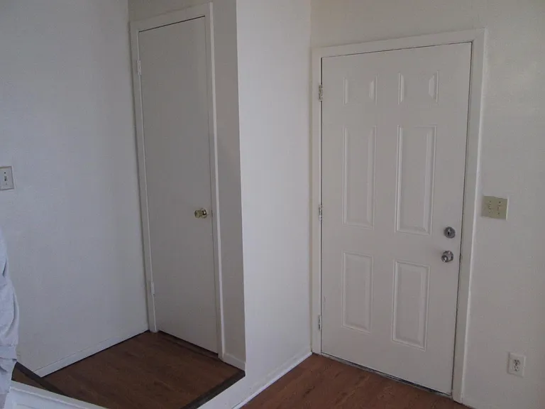entry and to second floor with guest closet