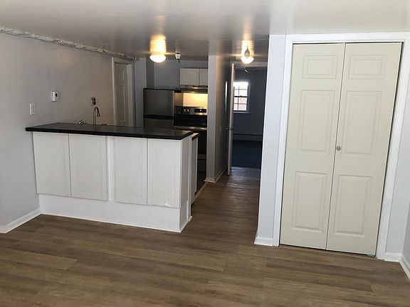 Living room facing the kitchen