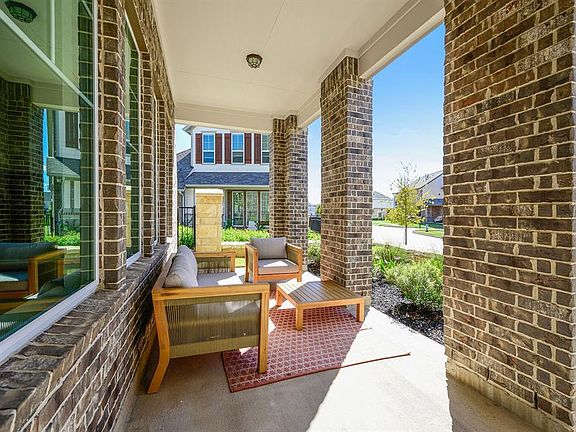 Imagine having your coffee in the morning or a nice beverage in the evening on this porch!