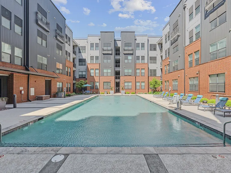 Large swimming pool with lounge areas