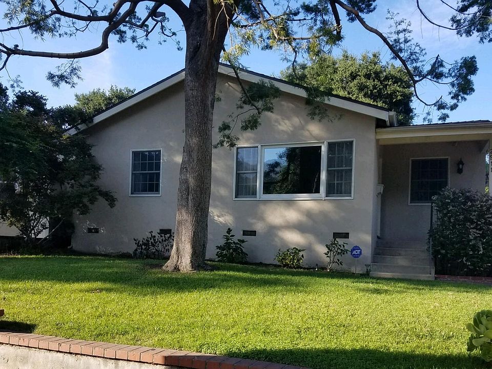 Nicely landscaped house in quiet neighborhood with mature shade trees