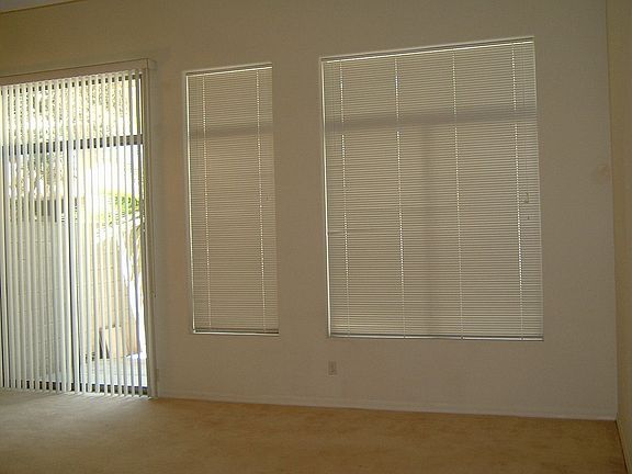 Family Room open to Kitchen and Dining Room with access to Rear Patio.