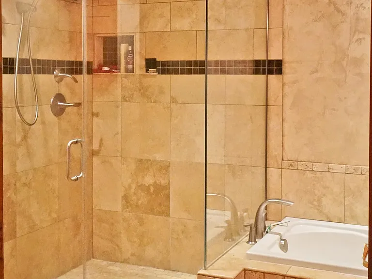 master bath 14 x 9. Extra large shower, jetted bath, floor to ceiling custom-made cabinet and in-floor heating