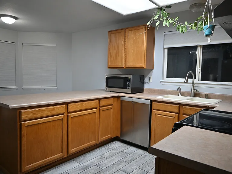 The kitchen with an instant hot water tap in the sink.