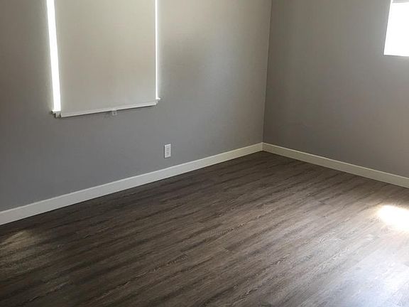 Bedroom #3; toward front of house. Large wall of closets.