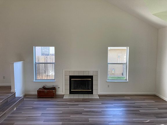 View to the right of the Entryway - Living Room with fireplace.