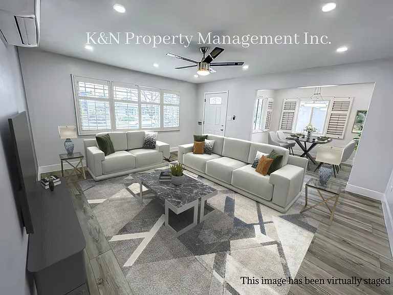 Large living room with large windows and lots of natural light