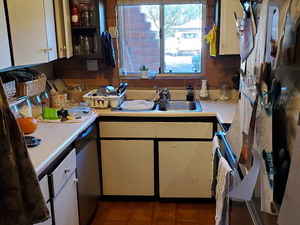 Kitchen with dishwasher, new microwave oven and range, new refrigerator.