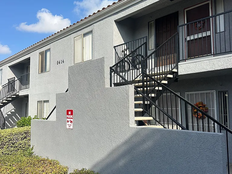 Building 6414 is another one bedroom one bathroom face the back of the property and more carport parking space.