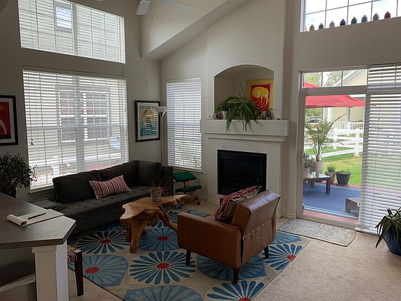 Cozy living room with great light and gas fireplace