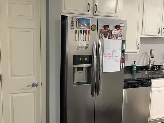 Pantry next to refrigerator