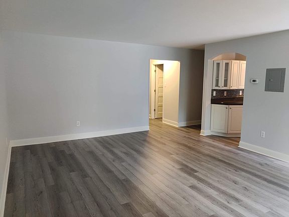 Living Room which opens to kitchen and dining room.