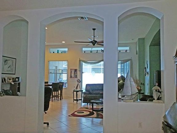 ARCHED ENTRY TO GREAT ROOM FROM FORMAL DINING ROOM