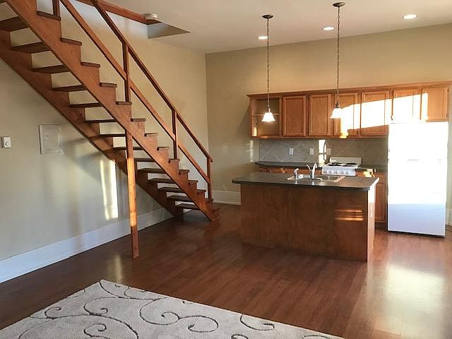 open floor plan with open stairway to loft