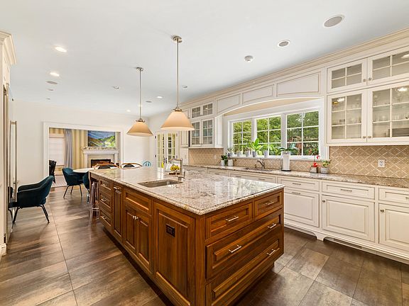 Gourmet kitchen with radiant heated floors, center island and top of the line appliances.
