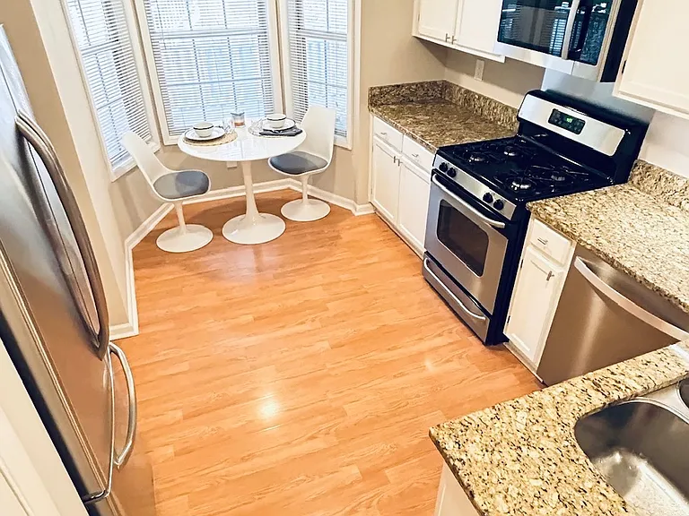 Bright kitchen with large pantry.
