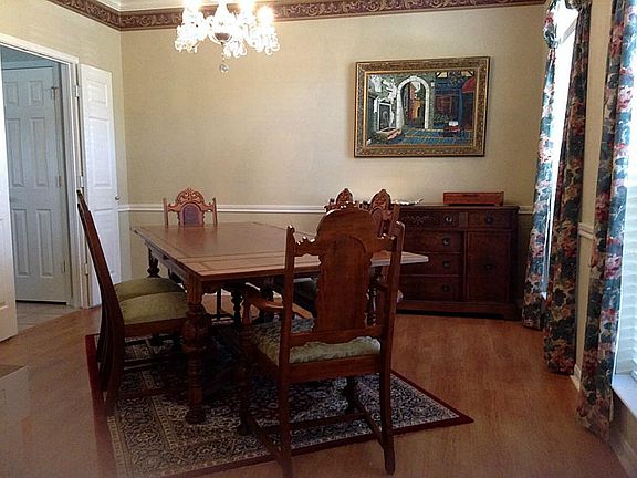 View of dining room with entrance to kitchen on the left