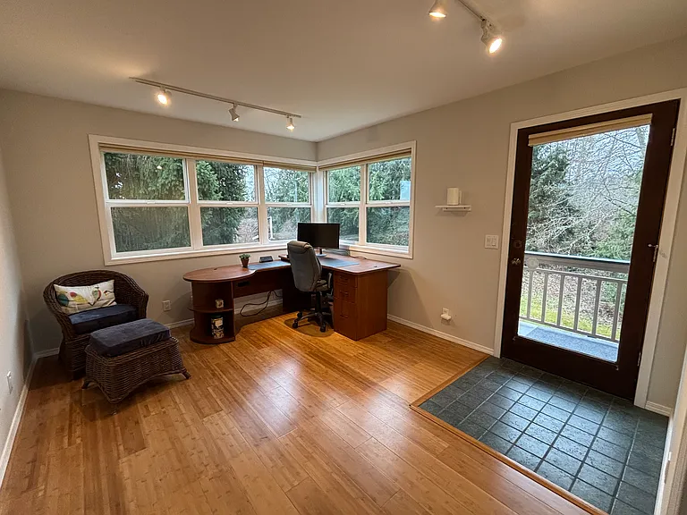 Large office with access to balcony.