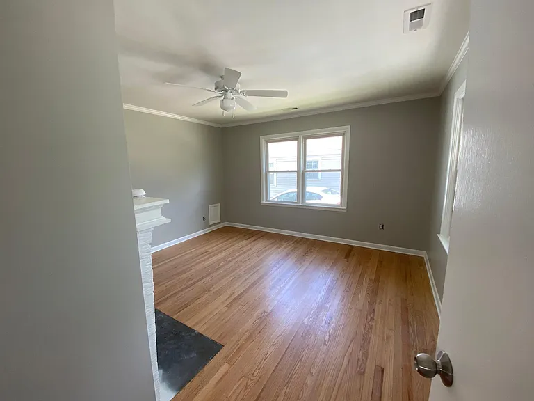 Beautiful, airy large bedroom with gorgeous restored 1940's hardwood floors. Fresh paint-of course!