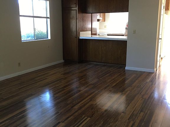 Freshly painted living room looking towards kitchen