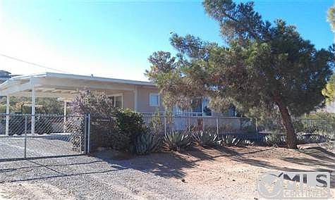 Fenced, Landscaped, shade trees, covered carport parking