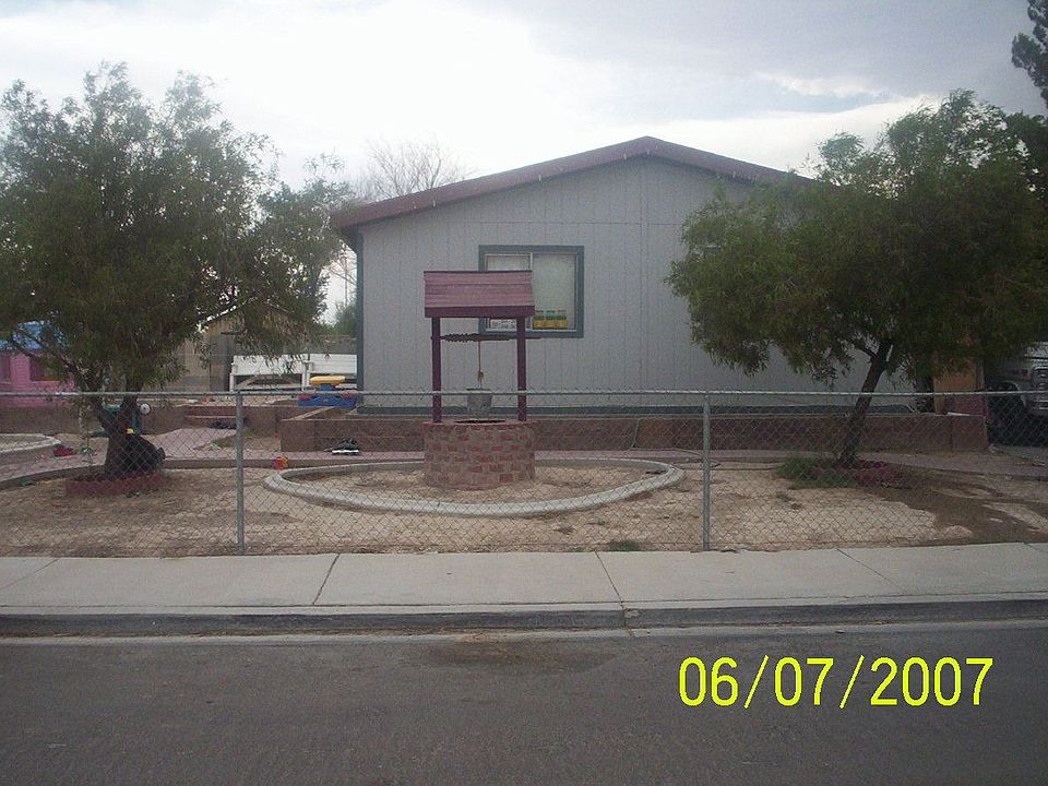 Front of house w/ decorative cement walkway, garden curbing,brick wishing well