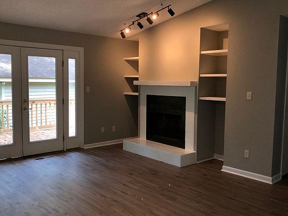 Living room and rear exit onto deck.