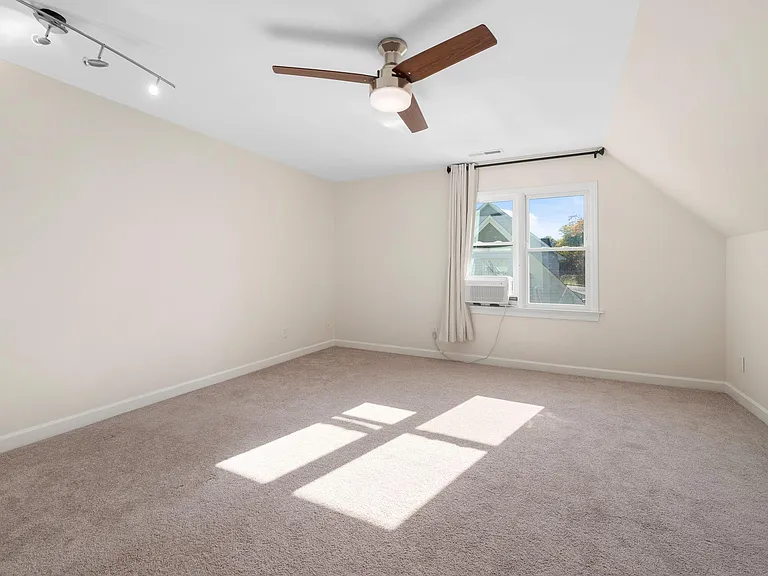 Large bonus room perfect for setting up a home office or storing items that need temperature control.