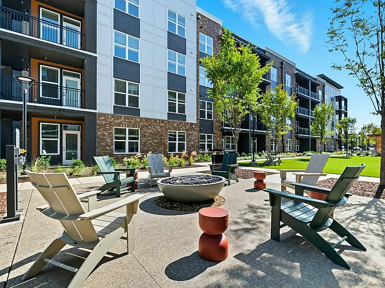 Gather with friends and neighbors around a cozy outdoor fire pit