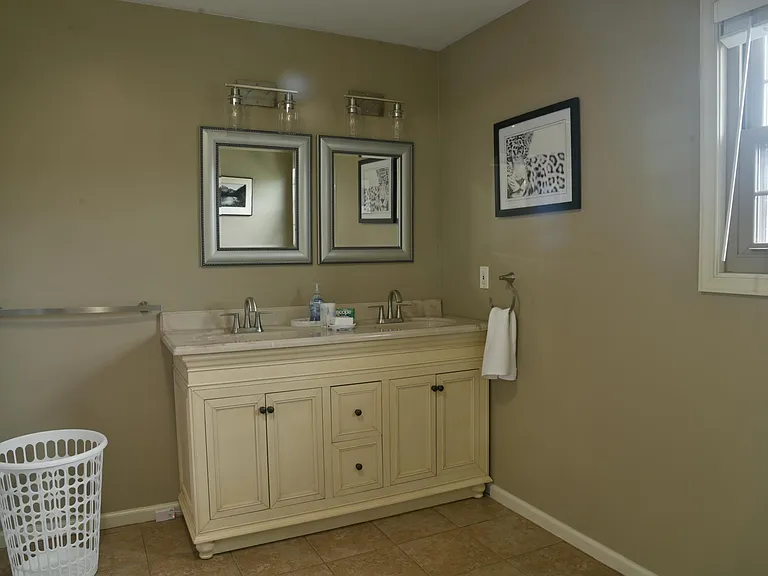 large, double sink, master bathroom with bathtub