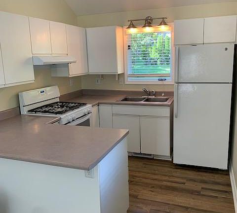 Compact kitchen...LOTS of cabinet space! Two lazy Suzans and draws under cabinet with outlet