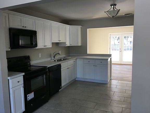 kitchen showing New stove, new dishwasher and new microwave