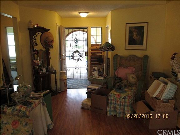 Living room view to front enclosed entryway.