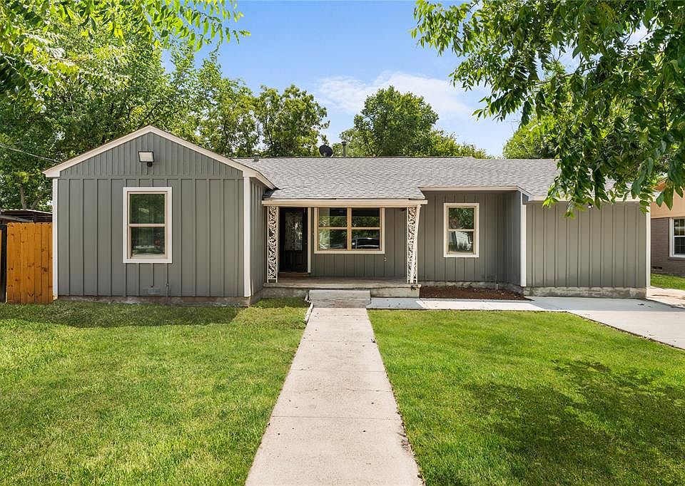 View of front of property featuring a shingled roof, board and batten siding, and a porch