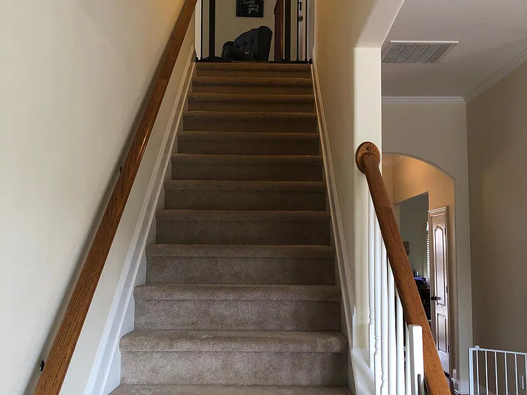 Stairs leading from first floor to second floor