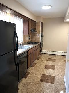 Kitchen after new floor, New lighting, New Dishwasher, new fridge...