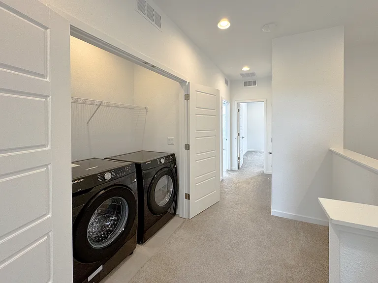 Dedicated laundry room conveniently located in the third floor with washer, dryer and additional storage space