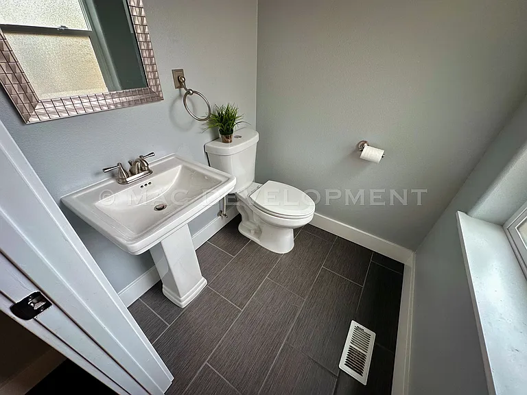 Downstairs bathroom right by back door.