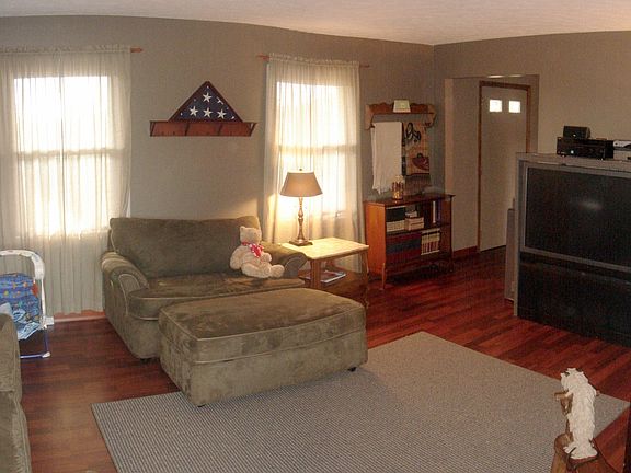A deep rich tone laminate flooring sets off the large, living room.