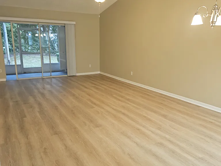 Living Room, vaulted ceilings, sliders to back enclosed patio