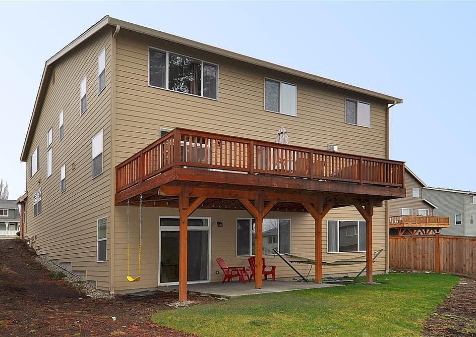 Back of home (backs to open spc)