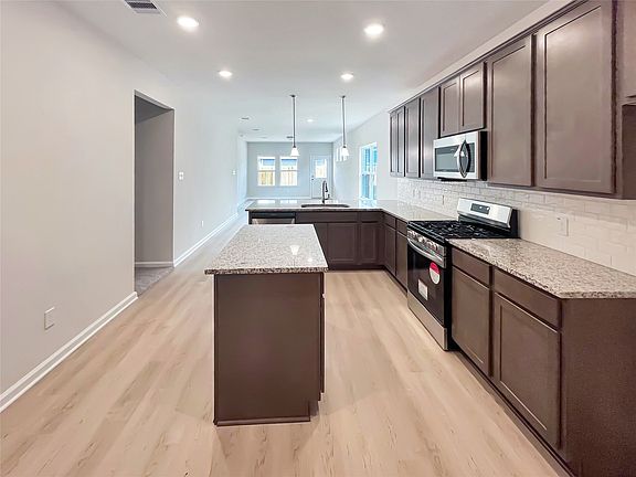 The Cardinal II- Spacious Kitchen with Ample Cabinet and Countertop Space. Home under construction,